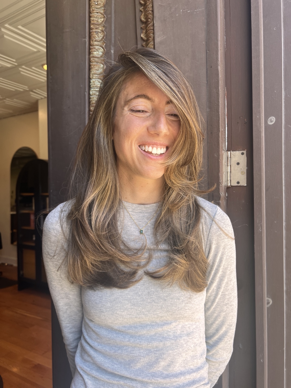 Long layered bronde haircut with a polished finish