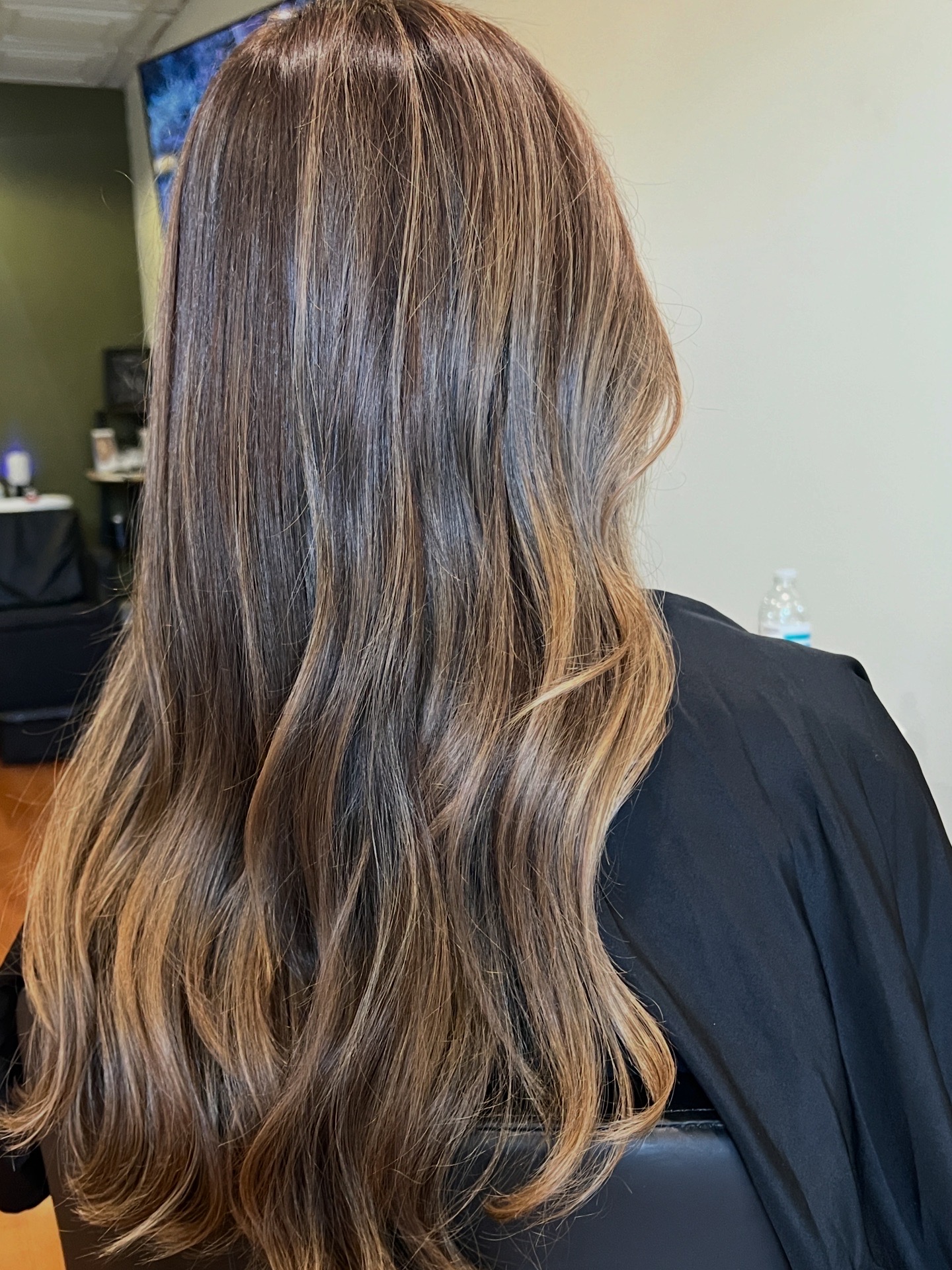 Long brunette hair with seamless caramel ribbon highlights
